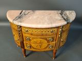 an image of a small marble topped chest of drawers
