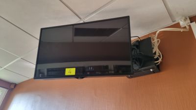 a flat screen tv mounted on a wall in a room