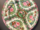 an image of a decorative plate with flowers and birds on it
