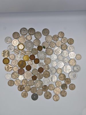 a lot of coins that are on the table