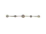 a close up of a metal bar with four metal balls on it