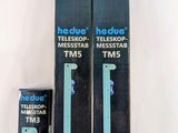 three boxes of toothbrushes sitting on a table