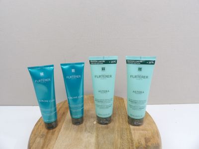 four different types of skin care products on a wooden tray