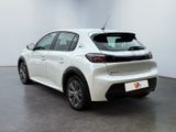 the rear end of a white car in a white room