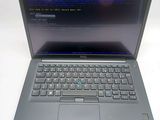 a laptop computer with a keyboard on a white surface