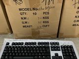 a keyboard and a mouse on the ground in front of boxes
