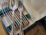 a silverware set in a case with a spoon and fork