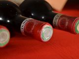 three bottles of wine sitting next to each other on a table