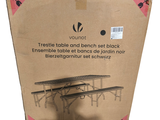 a cardboard box that has a table and bench set in it