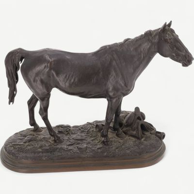a statue of a horse that is standing on a rock