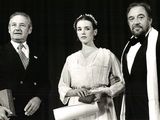 black and white photograph of a man and two women standing next to each other