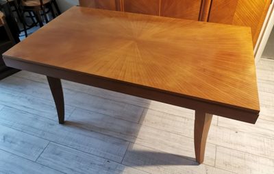 a wooden table that is sitting on the floor