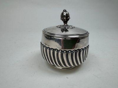 an image of a silver bowl with a bird on top