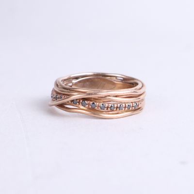 an image of a gold ring with diamonds on it