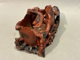 a small wooden bowl with a dragon on it