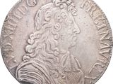 Gros plan sur une pièce de monnaie portant le visage d'un homme