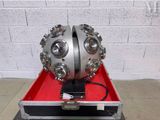 a large metal object in a case on a table