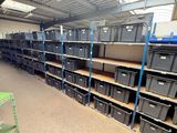 many boxes on the shelves in the warehouse