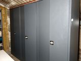 a room that has a bunch of metal cabinets in it