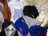a pile of clothes in a plastic bag on the floor