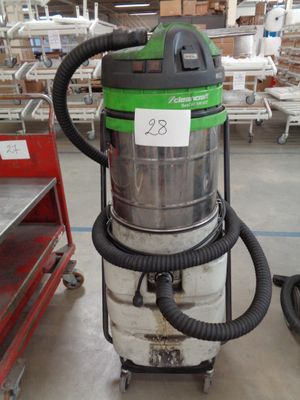 a vacuum that is sitting on a cart in a warehouse