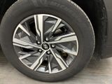 a close up view of a car ' s wheel and tire