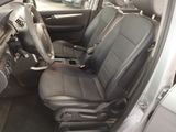 a picture of the interior of a car with a steering wheel