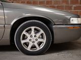 a picture of a silver car parked in a garage
