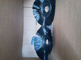 a cardboard box that has a pair of blue brushes inside of it