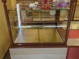 a display case with a lot of food inside of it