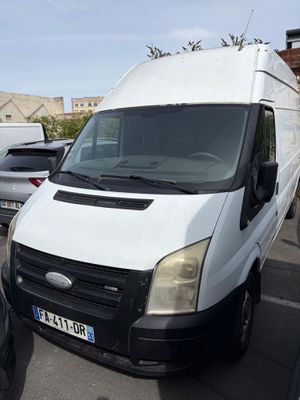 a white van that is parked in a parking lot