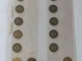 some coins are sitting in a clear bag on a table