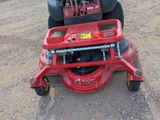 a red lawn mower that is sitting on the ground