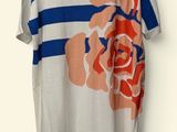 an image of a t - shirt hanging on a hanger