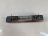 a small model of a train on a white surface