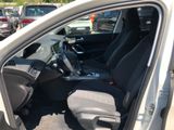 the interior of a car with the door open and the driver ' s seat down