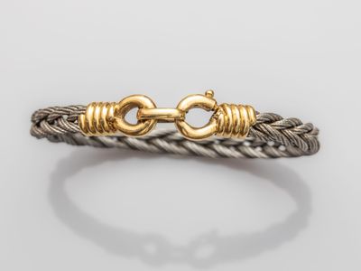 a gold and silver bracelet with a clasp