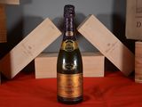a bottle of wine that is sitting on a table