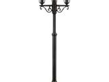 a black lamp post with three lanterns on top of it