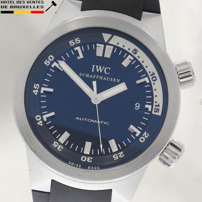 a close up of a wrist watch with a blue dial