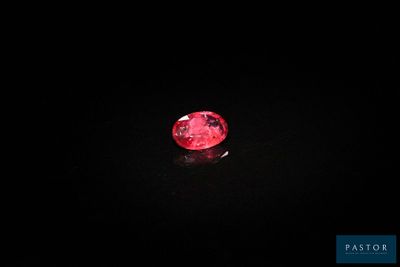 a red diamond on a black background