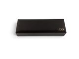 a close up of a black box on a white surface