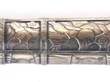 a silver and gold fountain pen with a yellow tip
