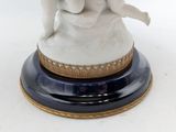 a figurine of an angel on a pedestal