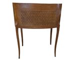 an image of a wooden chair with a woven back and legs