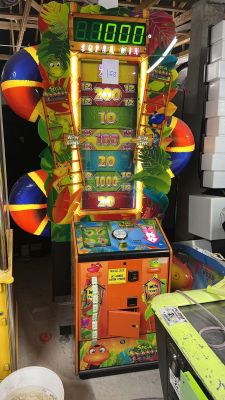 a game machine that has a clock on the front of it