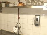 a sink in a kitchen with a lot of dishes on it