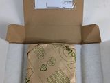 a box with a piece of paper inside of it