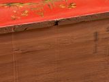 a red box with a gold design on it