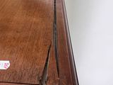 a wooden table with a piece of paper on it